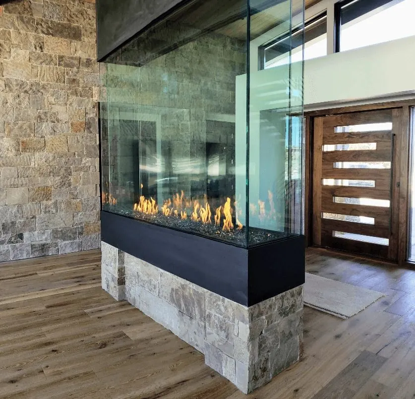 See-through fireplace installed by 1st Class Fireplace and Chimney
